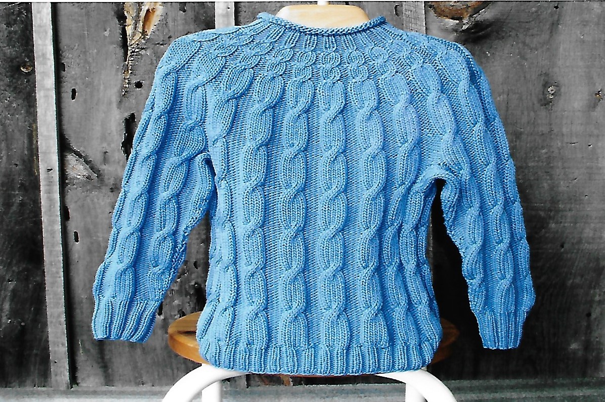 Cabin Fever 208 Knit in the Round Kid's Cable. Uses Double Knitting #3 weight yarn. Sizes 4 years to 8 years.